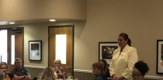 Michelle Luckett speaks to dinner attendees