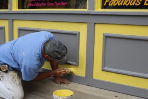 Worker painting a wall