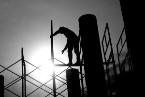 Construction worker standing on scaffolding