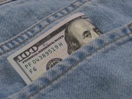 $100 bill in jeans pocket