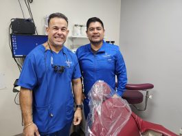 Dentists Gabriel Hernandez and assistant Ronnie Gonzales