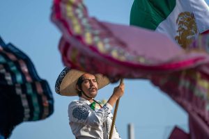 Charro holding Mexican flag