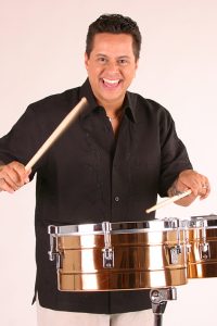 Tito Puente, Jr. holding drumsticks