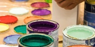Multiple cans of different colored paint