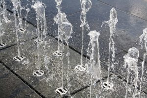 Water sprouting through concrete