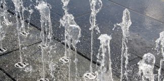 Water sprouting through concrete
