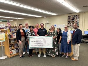 People holding an oversized check