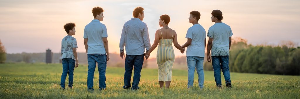 Family walking on field