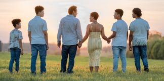 Family walking on field