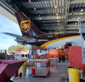 UPS brown tail inside and ST Engineering hangar