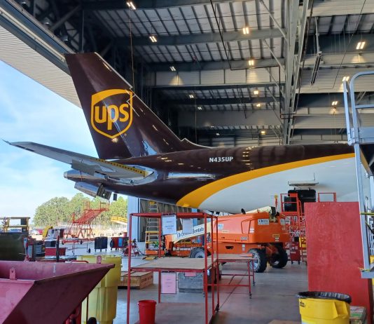 UPS brown tail inside and ST Engineering hangar