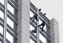 Window washers being rescued by fire department