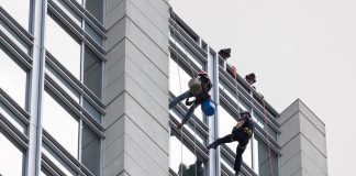 Window washers being rescued by fire department