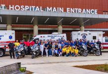 Hospital staff standing at Baptist Hospital Main Entrance