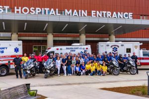 Hospital staff standing at Baptist Hospital Main Entrance