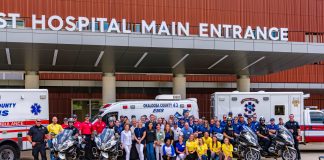 Hospital staff standing at Baptist Hospital Main Entrance