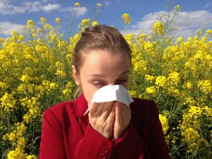 Person holding their nose