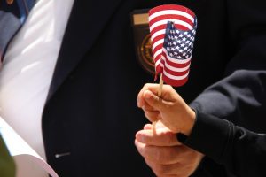 Child's hand holding an American flag