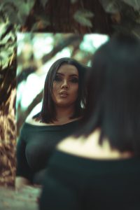 Woman looking into a mirror