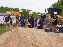 Group of people shoveling dirt