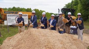 Group of people shoveling dirt