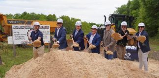 Group of people shoveling dirt
