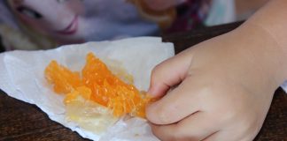 A child eating an orange