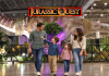 Family walking through Jurassic Quest exhibit