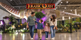 Family walking through Jurassic Quest exhibit