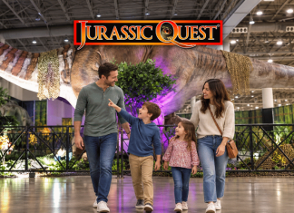 Family walking through Jurassic Quest exhibit
