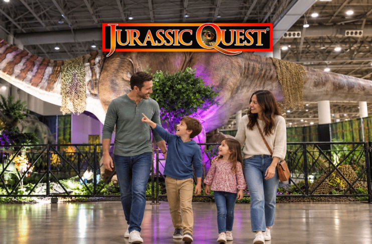 Family walking through Jurassic Quest exhibit